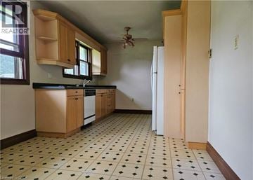 Ancaster apartment for rent - A kitchen with a black and white checkered floor.