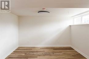 Toronto (Downsview-Roding-Cfb) apartment for rent - A room with a wooden floor and a smoke detector on the ceiling.