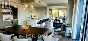 Toronto (Church-Yonge Corridor) condo for rent - A modern dining room with a dark table and chairs.