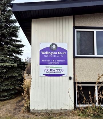 Edmonton apartment for rent - A sign for Wellington Court is posted on a door.