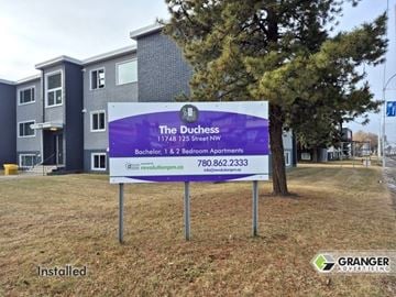 Edmonton apartment for rent - A sign for The Duchess apartment complex is installed in front of a building.