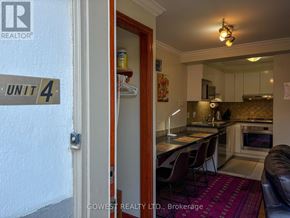 Toronto (High Park North) multi-family for rent - A kitchen with a red rug on the floor.