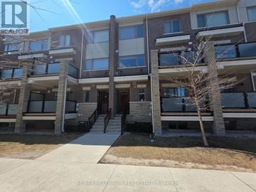 Brampton (Northwest Brampton) townhouse for rent - A kitchen with a refrigerator, oven, and microwave.
