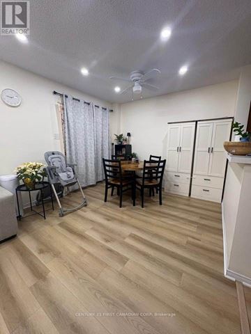 London North (North C) apartment for rent - A living room with a dining table and chairs.