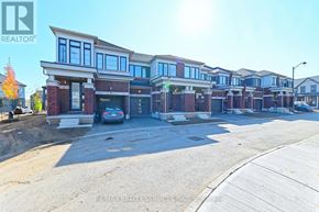 Cambridge townhouse for rent - A row of houses with a car parked in front of the first house.