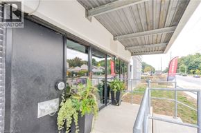 Kitchener condo for rent - A balcony with a metal railing and a glass door.