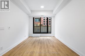 Toronto (Thorncliffe Park) condo for rent - A room with a view of a cityscape through a window.