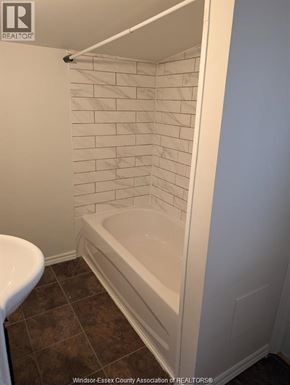 Windsor duplex for rent - A white tiled shower in a bathroom.