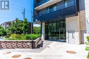 Toronto (Birchcliffe-Cliffside) condo for rent - A modern building with a glass entrance and a sign that reads "90 Central Park Rd.".