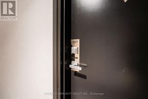 Toronto (Birchcliffe-Cliffside) condo for rent - A black door with a Realty logo on it.