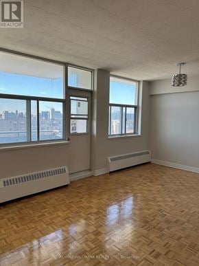 Toronto (Ionview) condo for rent - A room with a window and a radiator on the wall.
