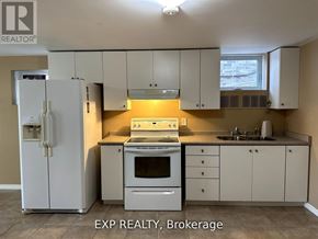 Barrie (Innis-Shore) apartment for rent - A kitchen with white cabinets and appliances is for sale.
