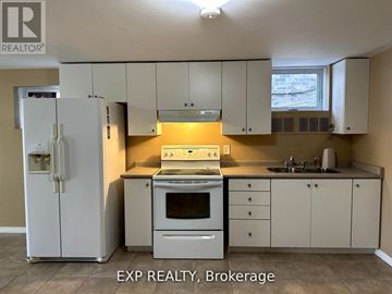 Barrie (Innis-Shore) apartment for rent - A kitchen with white cabinets and appliances is for sale.