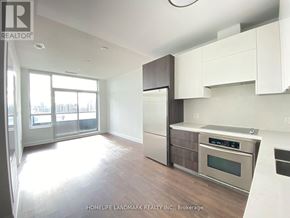 Markham (Unionville) condo for rent - A modern kitchen with white cabinets and stainless steel appliances.