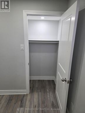 Brampton (Northwest Brampton) apartment for rent - A white door is open to a room with grey walls.