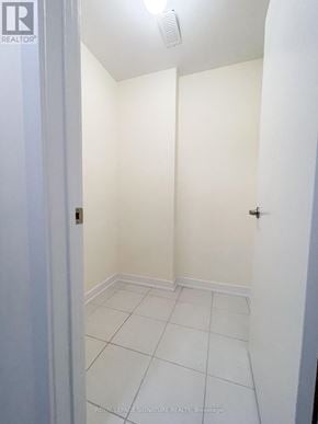 Hamilton (Lakeshore) townhouse for rent - A white hallway with a door on the left and a door on the right.