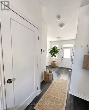 Kingston (City Northwest) apartment for rent - A hallway with a door on the left and a door on the right.