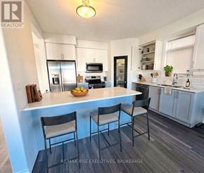 Kingston (City Northwest) apartment for rent - A kitchen with a table and chairs in the foreground.
