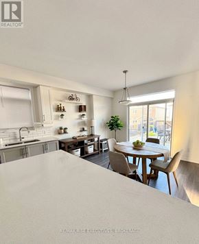 Kingston (City Northwest) apartment for rent - A modern kitchen with a dining table and chairs.