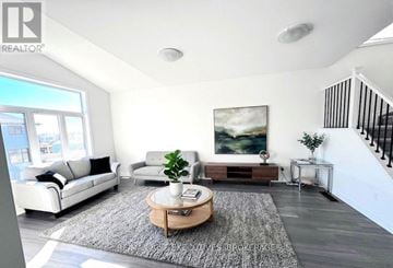 Kingston (City Northwest) apartment for rent - A living room with a white couch, a coffee table, and a painting on the wall.