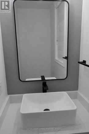 Whitby apartment for rent - A bathroom with a sink and a mirror.