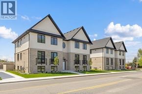 Tecumseh apartment for rent - A row of houses with the REALTOR® logo on the bottom left.
