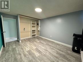 Kitchener condo for rent - A room with a door and a wall with a shelf.