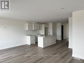 Niagara Falls (Brown) townhouse for rent - A real estate company is showcasing a kitchen area in a property.