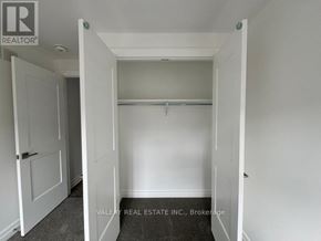Niagara Falls (Brown) townhouse for rent - A white door with a sign that says REALTOR.
