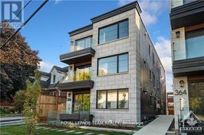 Ottawa apartment for rent - A modern multi-story building with the number 364 on it.