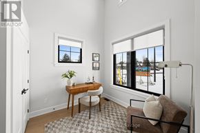 Ottawa townhouse for rent - A room with a table, chairs, and a window overlooking a street.