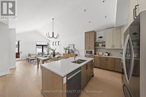 Ottawa townhouse for rent - A modern kitchen with wooden cabinets and a large island.