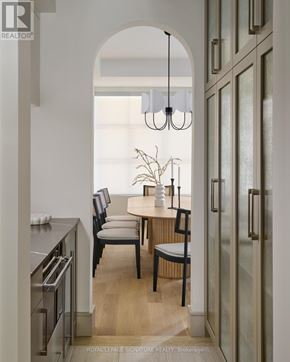Toronto (Playter Estates-Danforth) apartment for rent - A modern kitchen with a dining table and chairs.