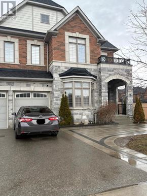 East Gwillimbury (Holland Landing) apartment for rent - A black car is parked in front of a two-story house.