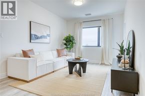 Lasalle condo for rent - A living room with a white couch, a coffee table, and a painting on the wall.