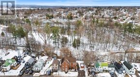 Pembroke multi-family for rent - A bird's eye view of a snowy residential area.