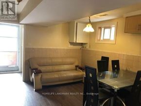 Toronto (Pleasant View) apartment for rent - A living room with a couch, chairs, and a dining table.
