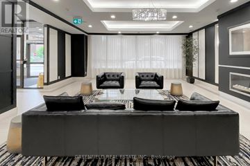 Toronto (York University Heights) condo for rent - A black and white living room with a large table and chairs.