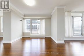 Toronto (York University Heights) condo for rent - A room with wooden floors and white walls.