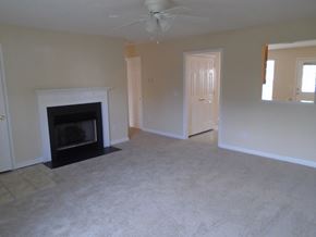 Lebanon apartment for rent - an empty living room with a fireplace
