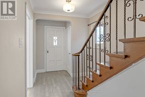 Toronto (O'connor-Parkview) apartment for rent - A hallway with a staircase and a door.