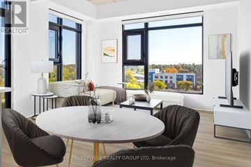Ottawa apartment for rent - A modern living room with a large table and chairs.