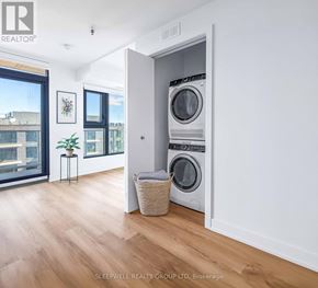 Ottawa apartment for rent - A laundry room with a washer and dryer in it.