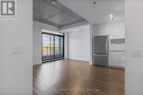 Ottawa apartment for rent - A room with a refrigerator and a window overlooking the beach.
