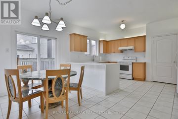Markham (Cachet) apartment for rent - A kitchen with a table and chairs in the foreground.