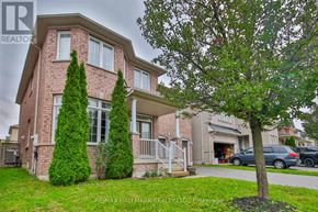 Markham (Cachet) apartment for rent - A house with a tree in front of it.