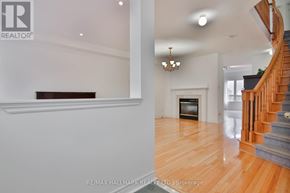Markham (Cachet) apartment for rent - A living room with a fireplace and a staircase.