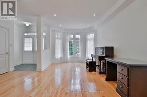 Markham (Cachet) apartment for rent - A spacious room with wooden floors and white walls.