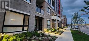 Oakville (Go Glenorchy) condo for rent - A building with the sign "Royal LePage Signature Realty Brokerage" is shown.