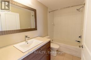 St. Catharines (Vine/Linwell) multi-family for rent - A bathroom with a sink, toilet, and bathtub.